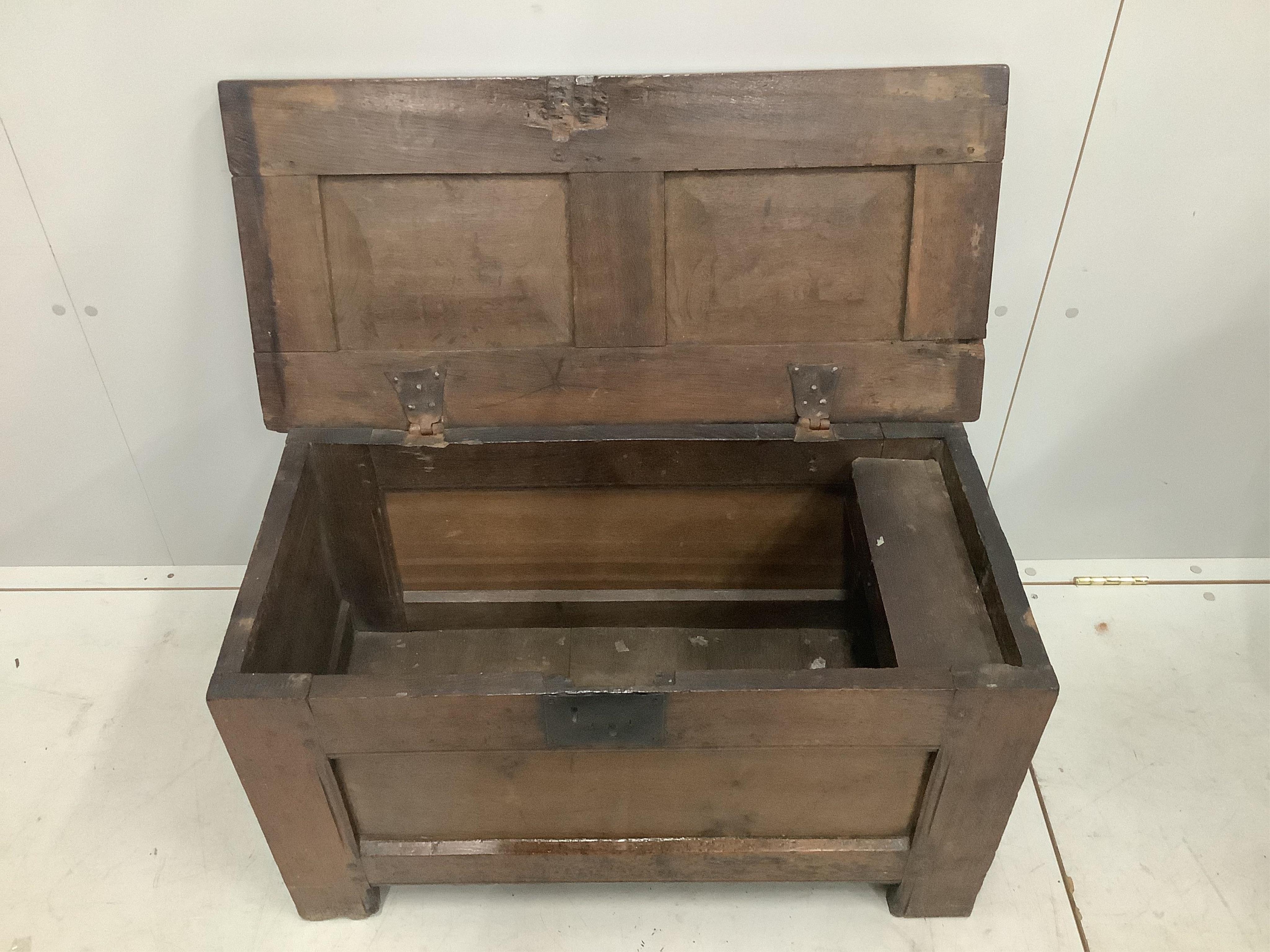 A small 17th century oak coffer, original wrought iron butterfly hinges, width 84cm, height 46cm. Purchased from Barling of Mount Street, London, 19th August 1977 for £585. Condition - fair to good
